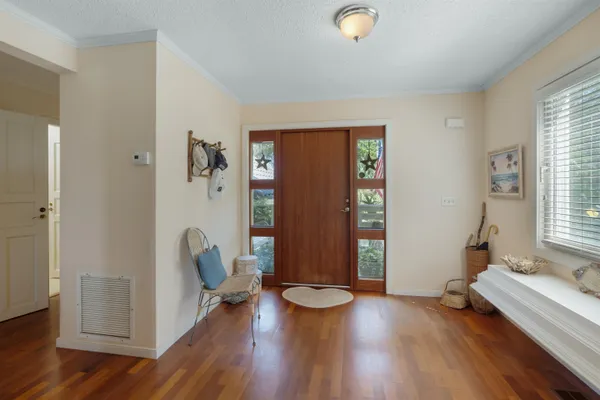 a view of room with lounge chair and windows