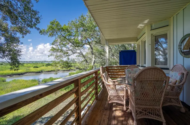 a view of balcony with furniture
