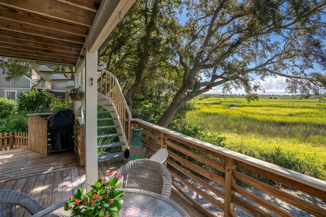 a view of swimming pool with outdoor seating and plants