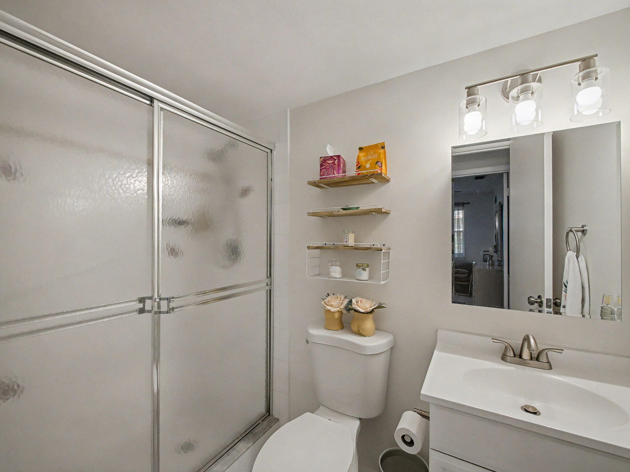1967 Southwest Palm City Road, Unit 34C Stuart, FL 34994 - Photo 12 of 25 a bathroom with a sink toilet and shower