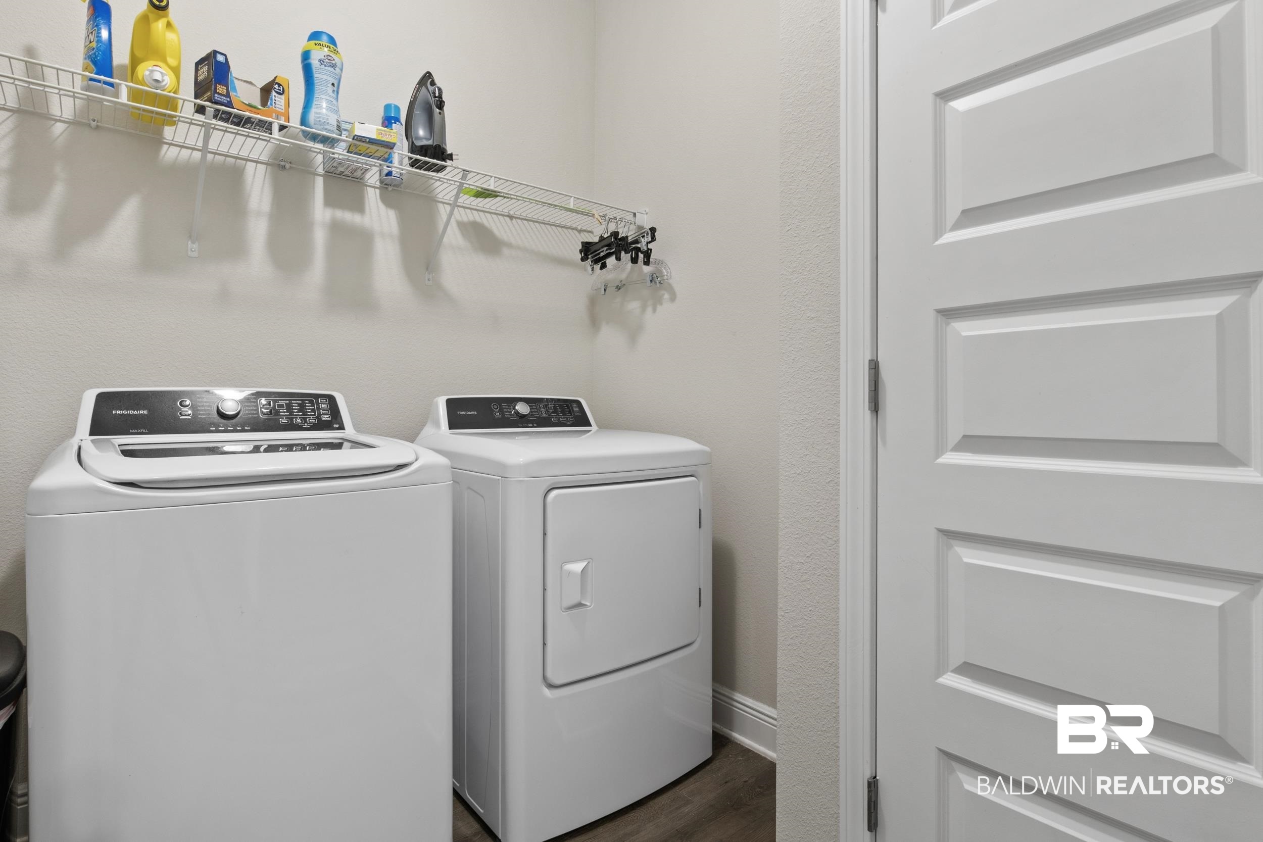 2050 Bourbon Street Foley, AL 36535 - Photo 29 of 32 Clothes washing area with separate washer and dryer and dark hardwood / wood-style floors