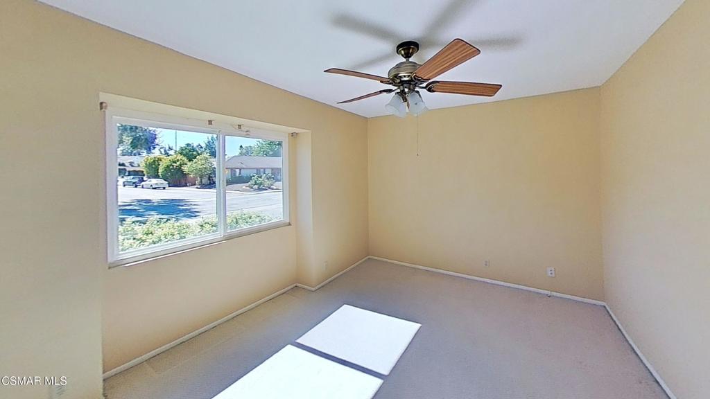 205 Larkhill Street Thousand Oaks, CA 91360 - Photo 18 of 26 a view of a big room with wooden floor a ceiling fan and windows