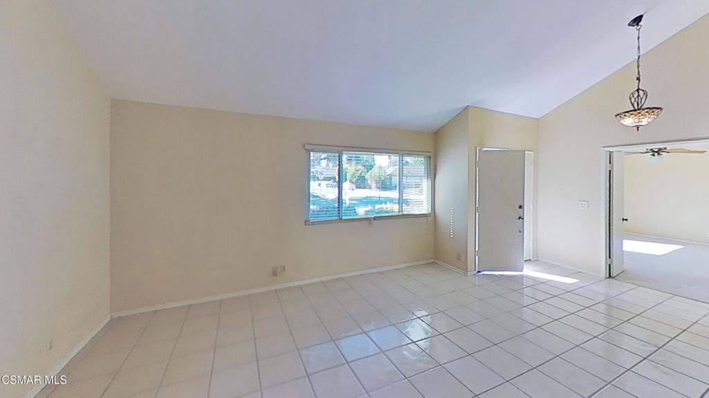205 Larkhill Street Thousand Oaks, CA 91360 - Photo 4 of 26 a view of an empty room with window and chandelier