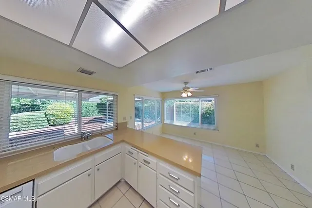 a view of a kitchen and window