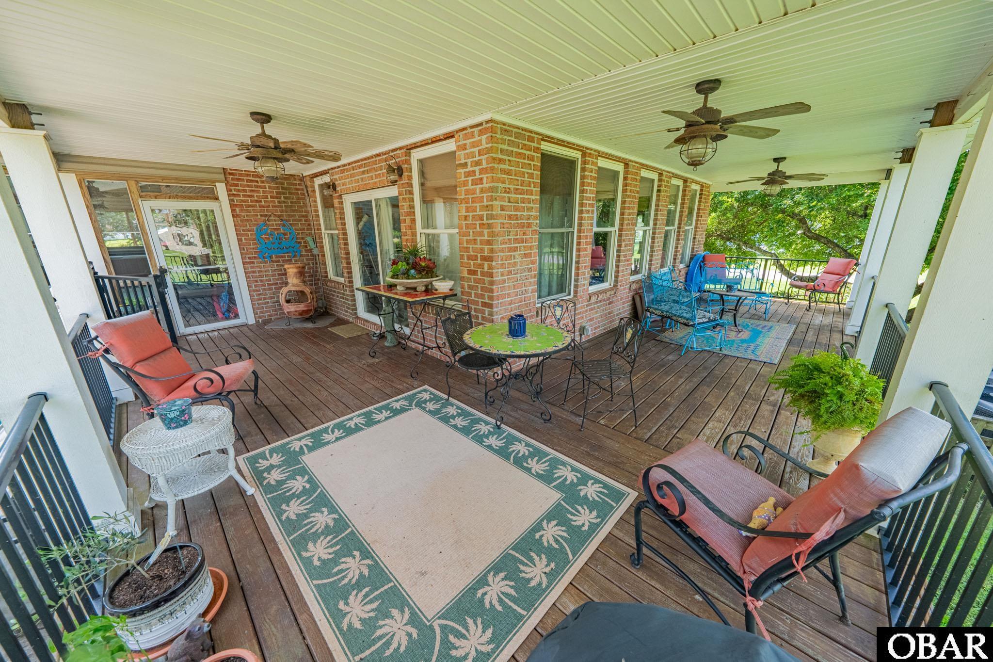 118 Neversail Way Coinjock, NC 27923 - Photo 31 of 50 Covered Wrap Porch