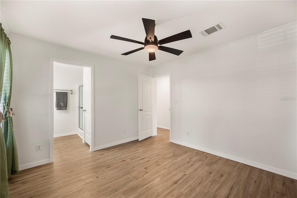 4900 J Jackson Road Fort Meade, FL 33841 - Photo 21 of 97 a view of empty room with wooden floor