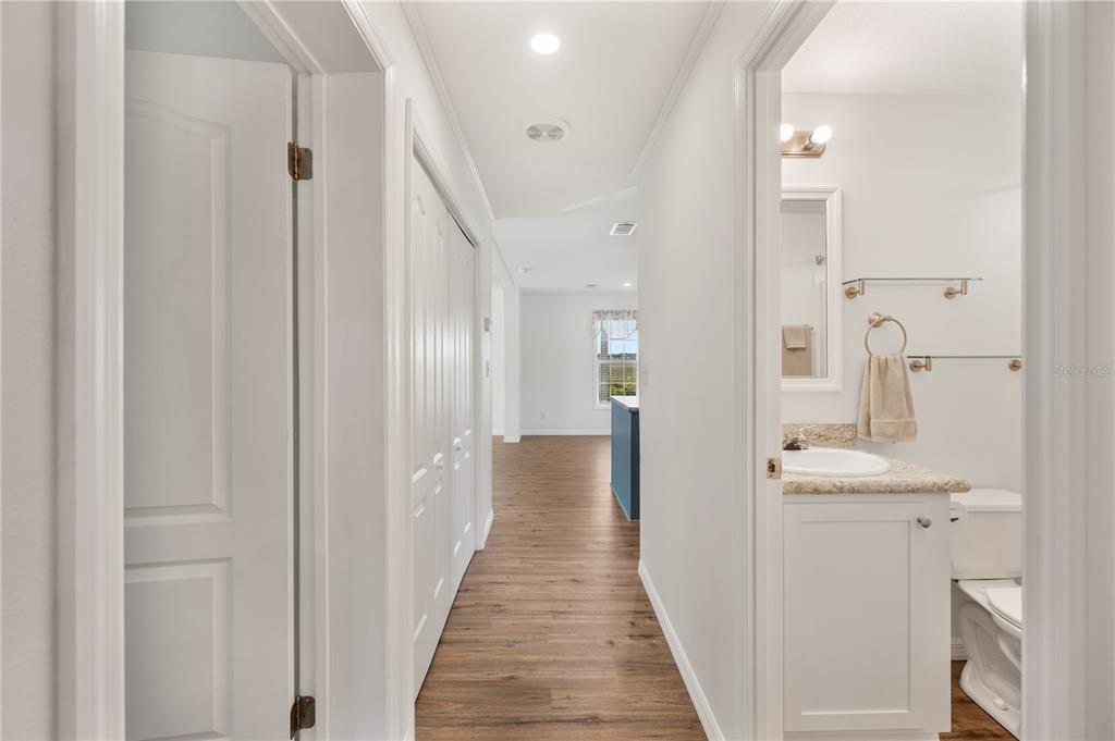 4900 J Jackson Road Fort Meade, FL 33841 - Photo 23 of 97 a view of a hallway with a white walls and wooden floor
