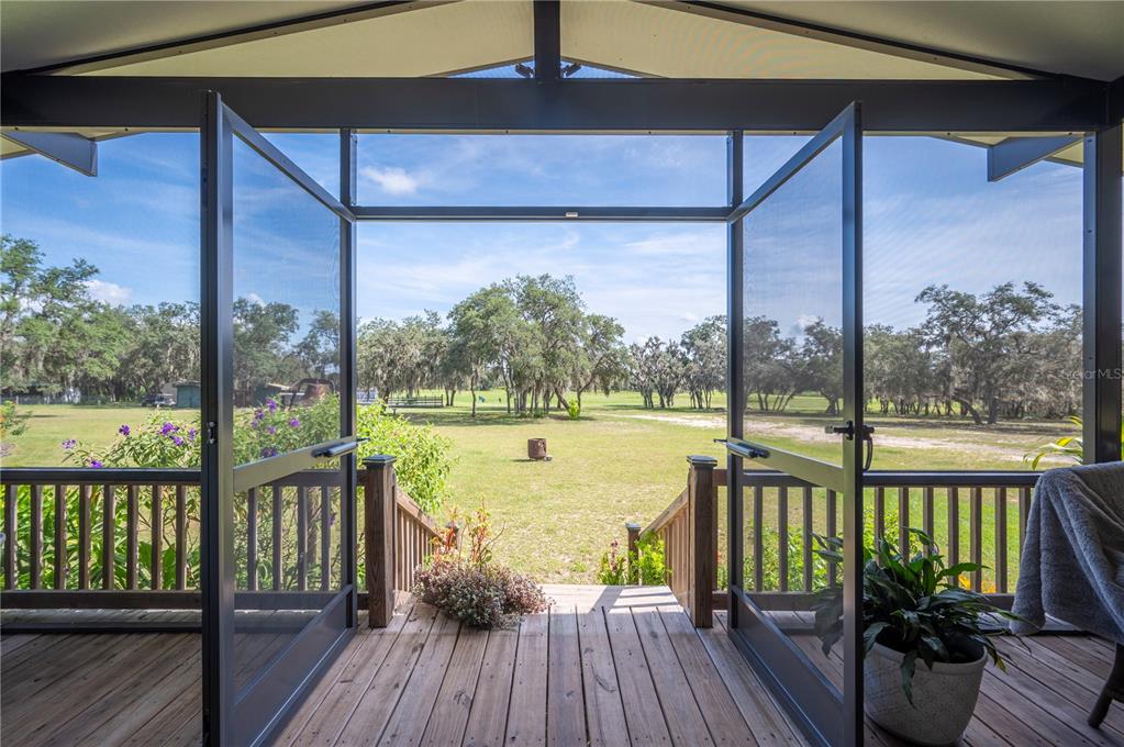 4900 J Jackson Road Fort Meade, FL 33841 - Photo 28 of 97 a view of a balcony with lake view and a ocean view