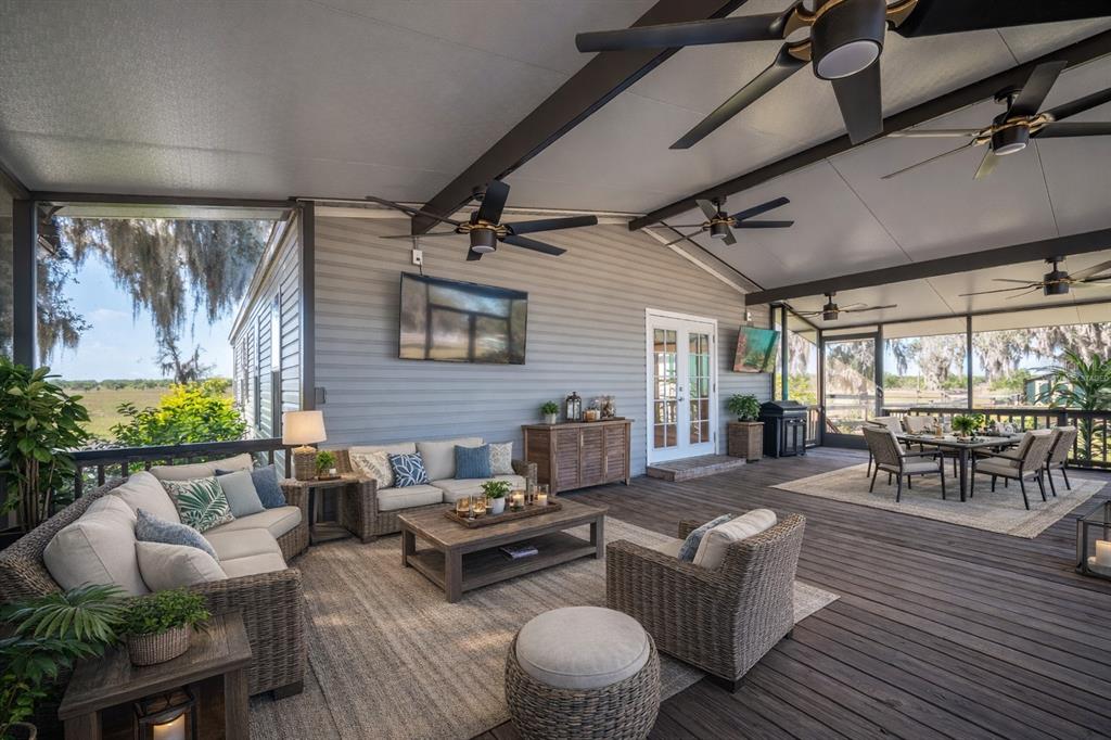 4900 J Jackson Road Fort Meade, FL 33841 - Photo 30 of 97 a living room with furniture and a large window