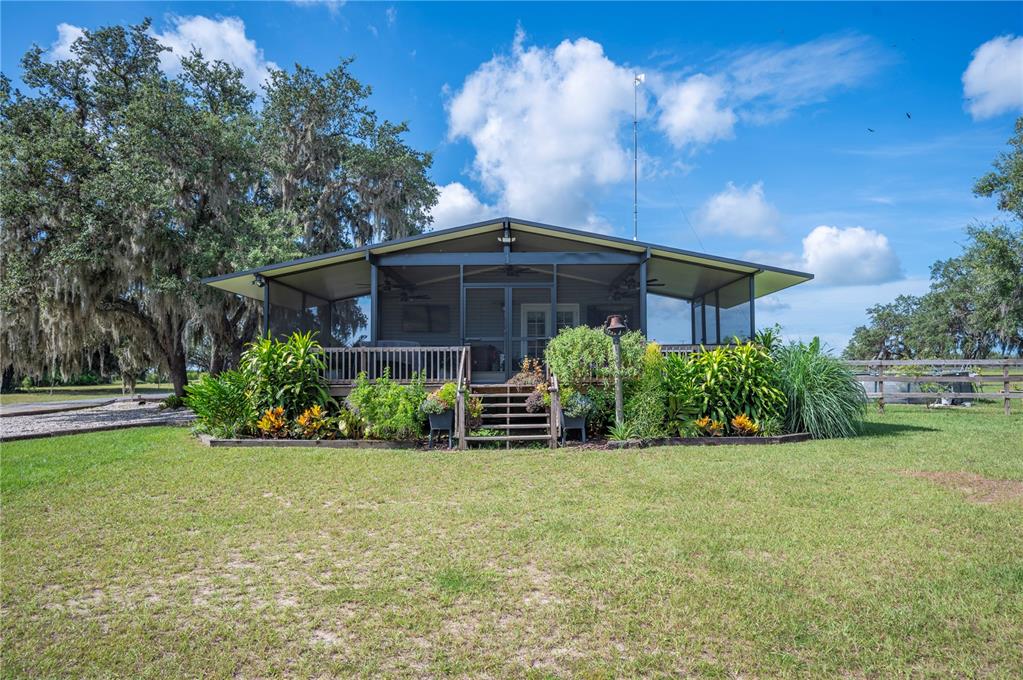 4900 J Jackson Road Fort Meade, FL 33841 - Photo 34 of 97 a view of a house with a yard