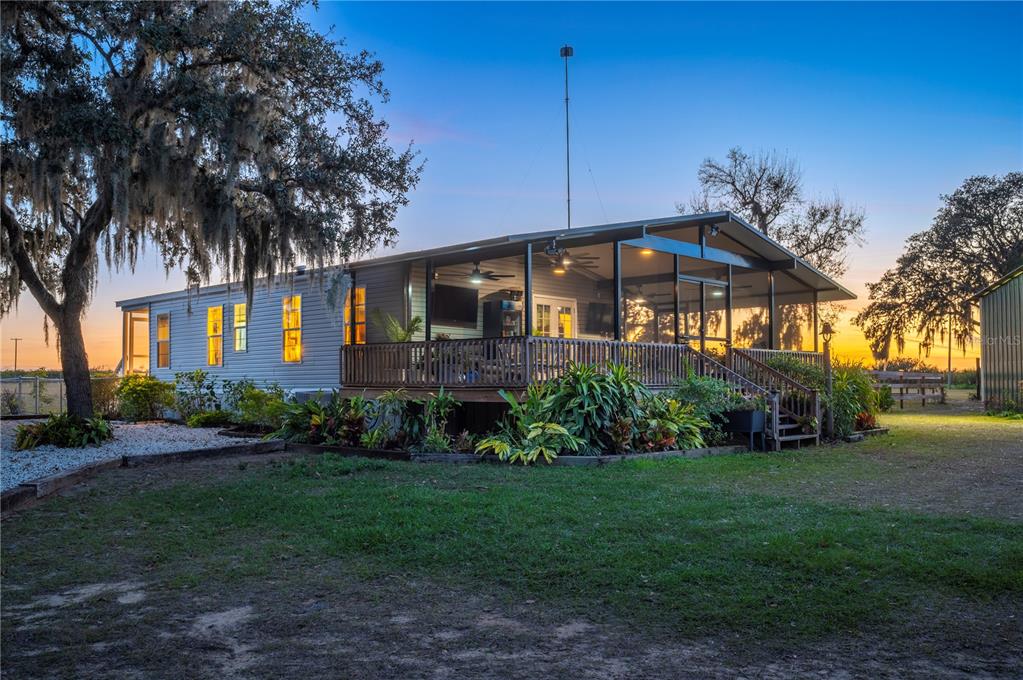 4900 J Jackson Road Fort Meade, FL 33841 - Photo 36 of 97 a front view of a house with garden