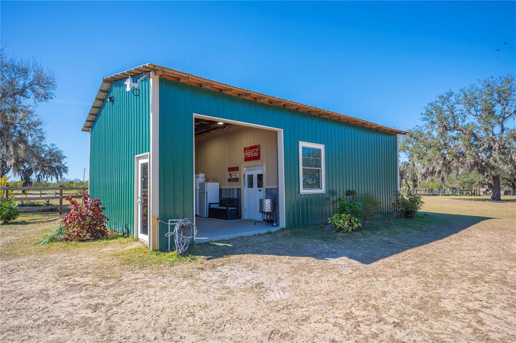 4900 J Jackson Road Fort Meade, FL 33841 - Photo 49 of 97 a view of a house with backyard and trees