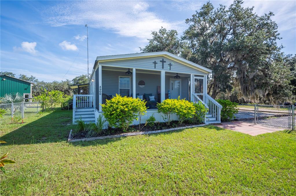 4900 J Jackson Road Fort Meade, FL 33841 - Photo 6 of 97 a front view of a house with a yard