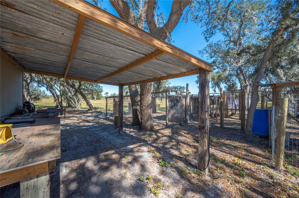 4900 J Jackson Road Fort Meade, FL 33841 - Photo 70 of 97 a view of a backyard with wooden floor
