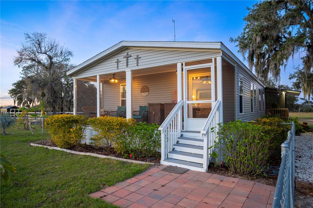 4900 J Jackson Road Fort Meade, FL 33841 - Photo 7 of 97 a front view of a house with garden