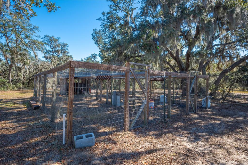 4900 J Jackson Road Fort Meade, FL 33841 - Photo 78 of 97 a view of a house with backyard porch and sitting area