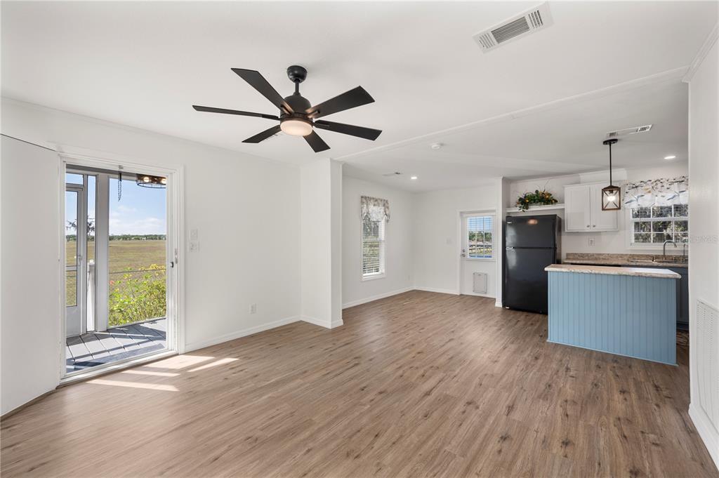 4900 J Jackson Road Fort Meade, FL 33841 - Photo 9 of 97 a view of a kitchen with wooden floor and a window