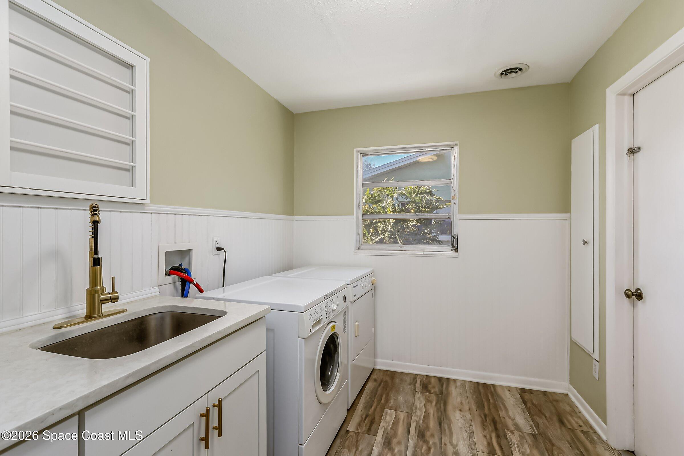 1275 Troon Way Rockledge, FL 32955 - Photo 13 of 61 a utility room with sink dryer and washer