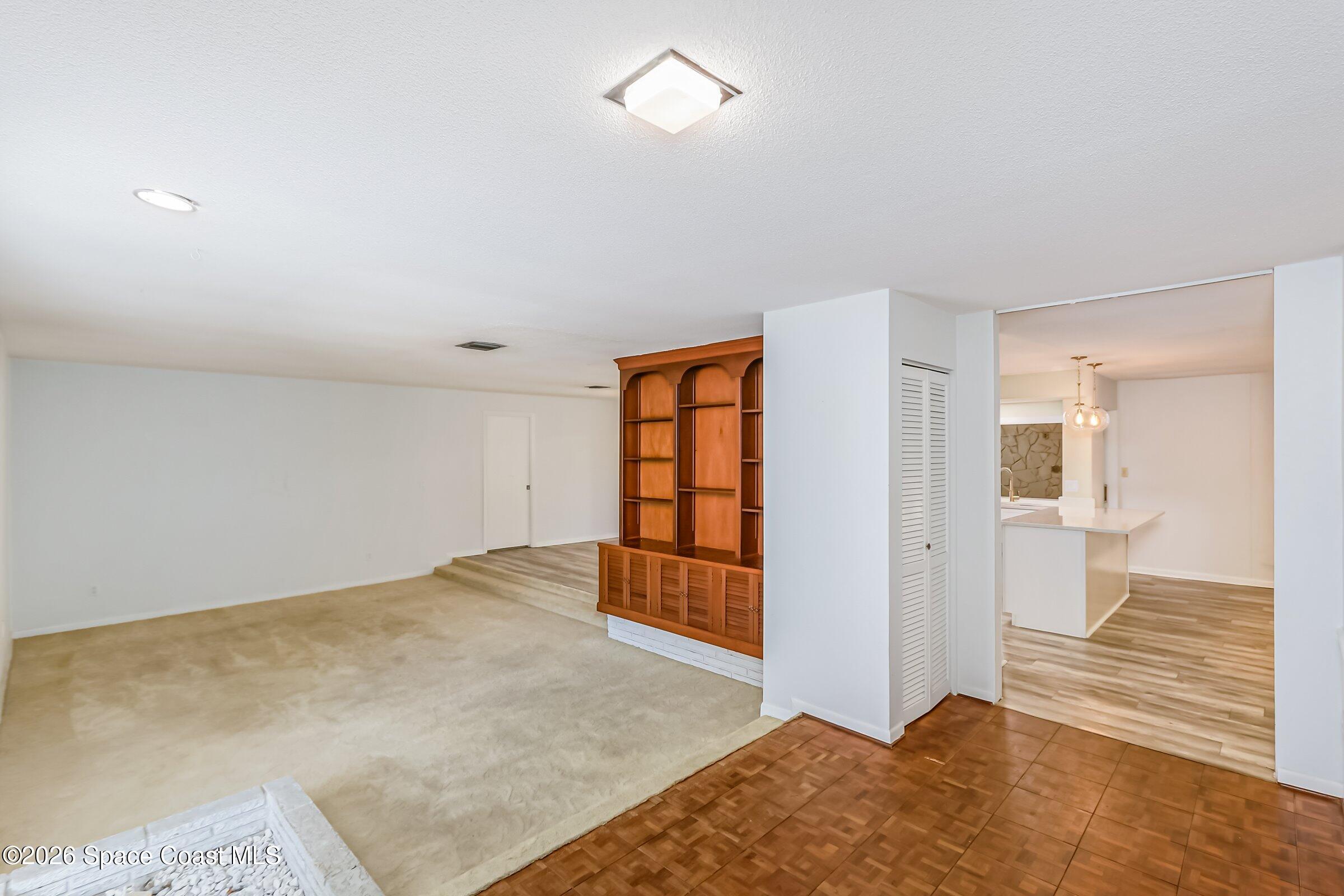 1275 Troon Way Rockledge, FL 32955 - Photo 19 of 61 a view of livingroom with hardwood floor and bathroom