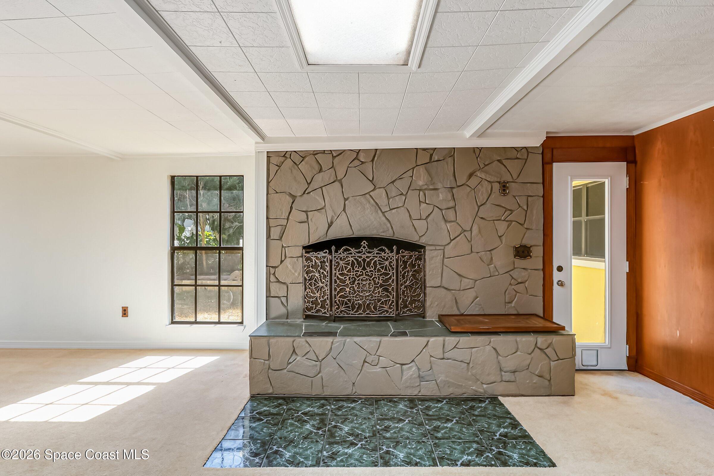 1275 Troon Way Rockledge, FL 32955 - Photo 26 of 61 a living room with a couch and a rug