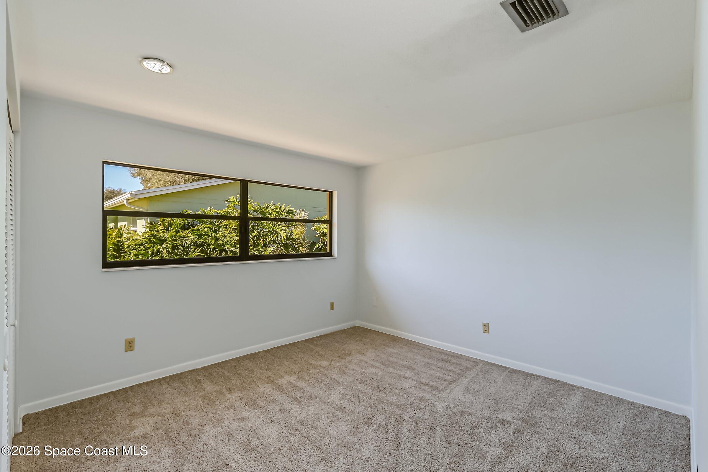 1275 Troon Way Rockledge, FL 32955 - Photo 31 of 61 an empty room with window