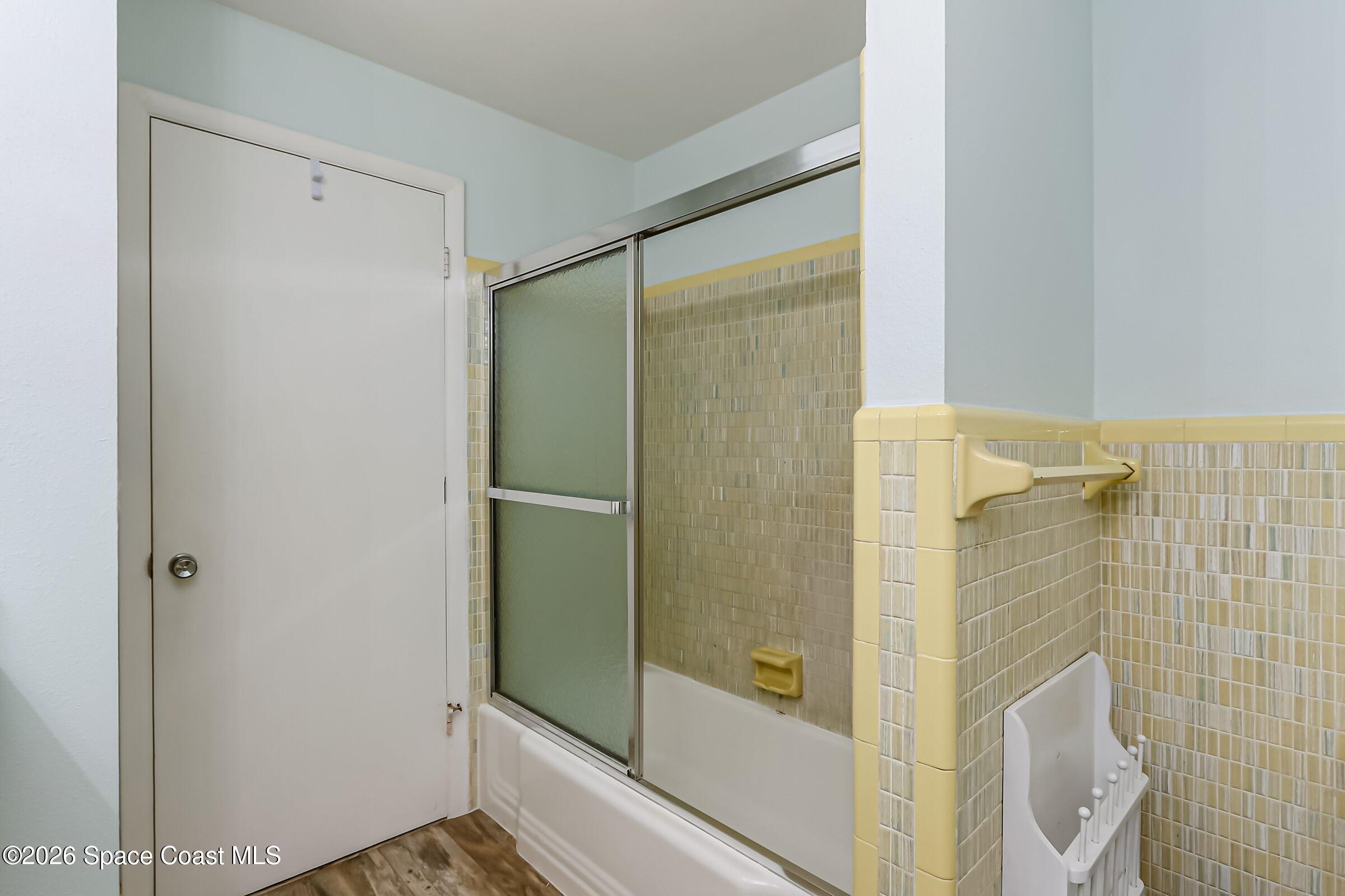 1275 Troon Way Rockledge, FL 32955 - Photo 35 of 61 a bathroom with a shower and a glass door