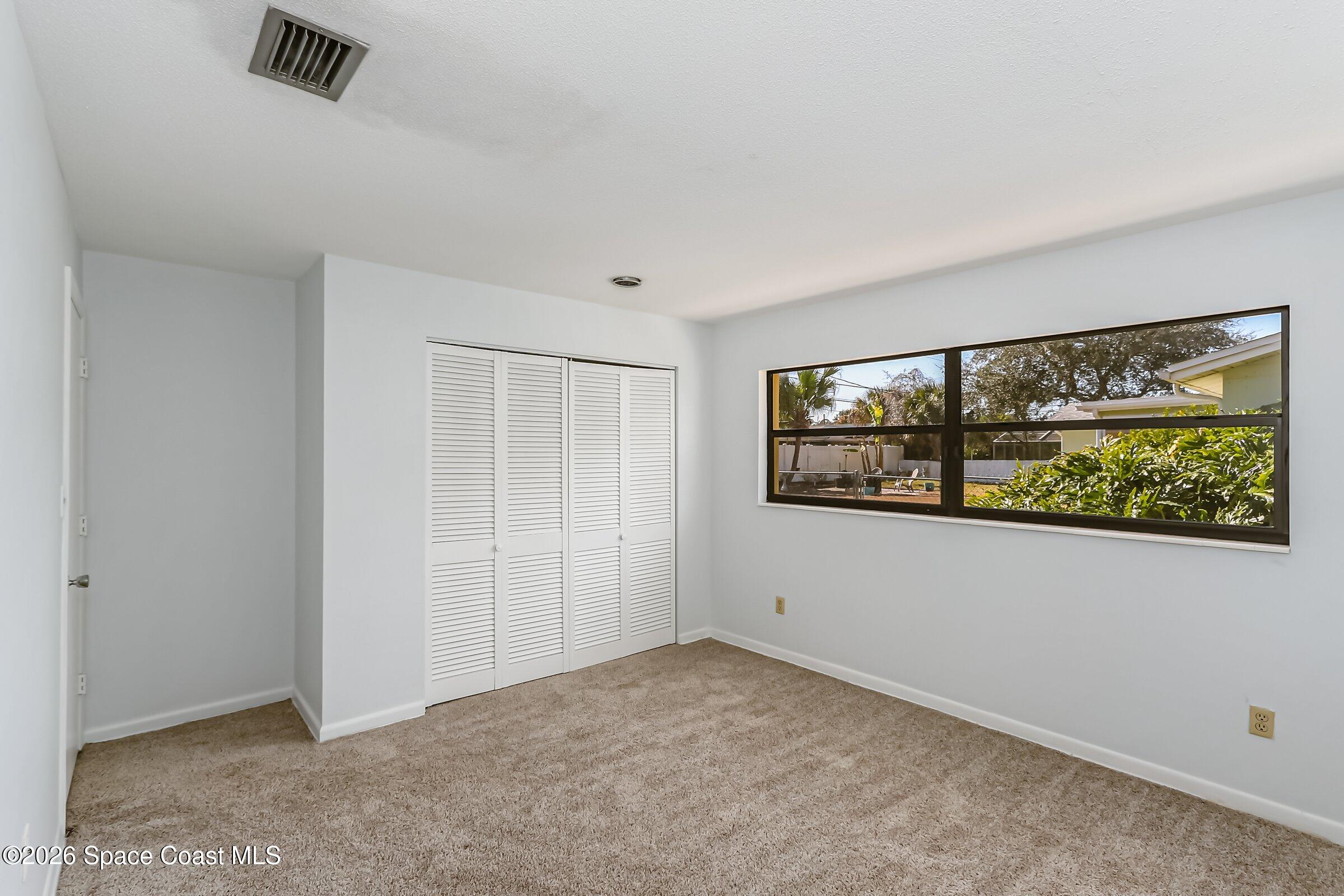 1275 Troon Way Rockledge, FL 32955 - Photo 37 of 61 an empty room with a window