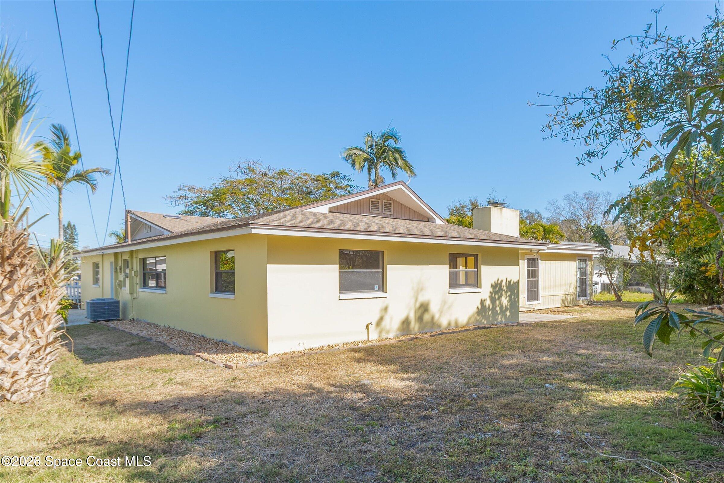 1275 Troon Way Rockledge, FL 32955 - Photo 49 of 61 front view of a house with a yard