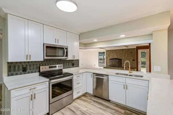 a view of kitchen view and wooden floor