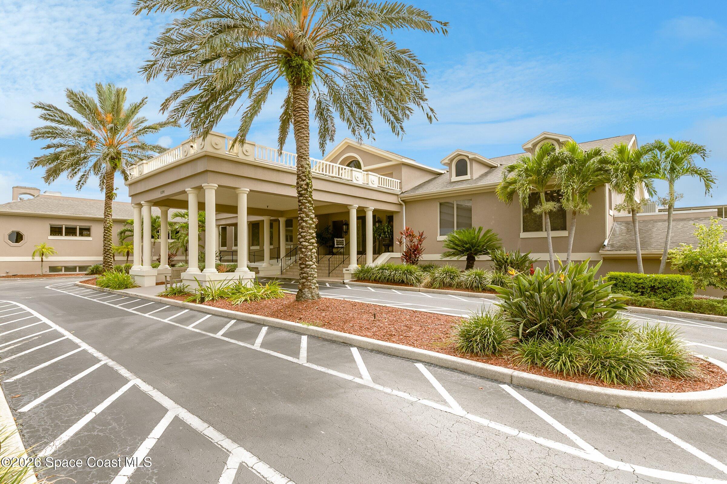 1275 Troon Way Rockledge, FL 32955 - Photo 55 of 61 a front view of a house with a garden
