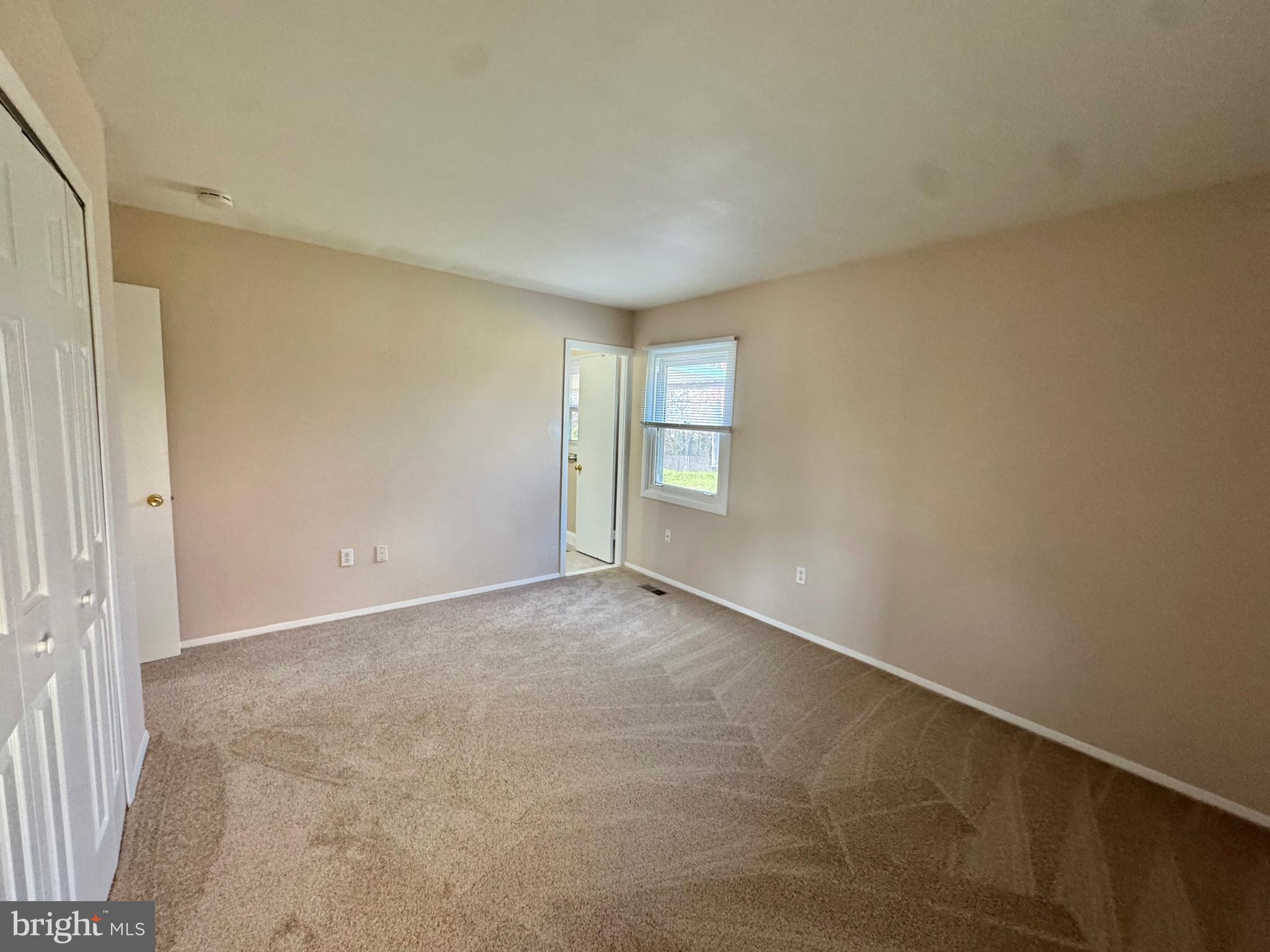 15758 Pointer Ridge Drive Bowie, MD 20716 - Photo 15 of 26 an empty room with windows