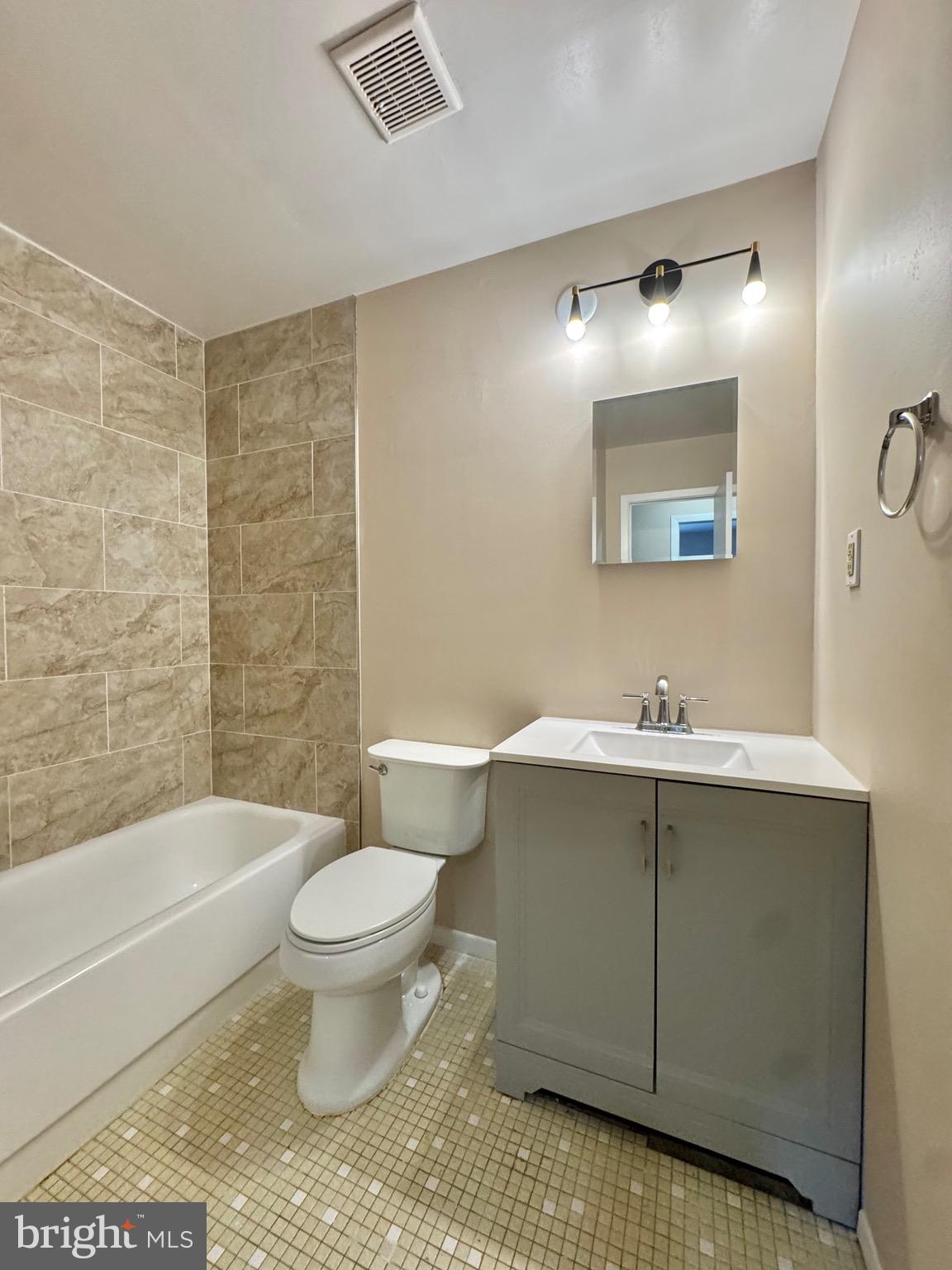 15758 Pointer Ridge Drive Bowie, MD 20716 - Photo 21 of 26 a bathroom with a sink toilet and shower