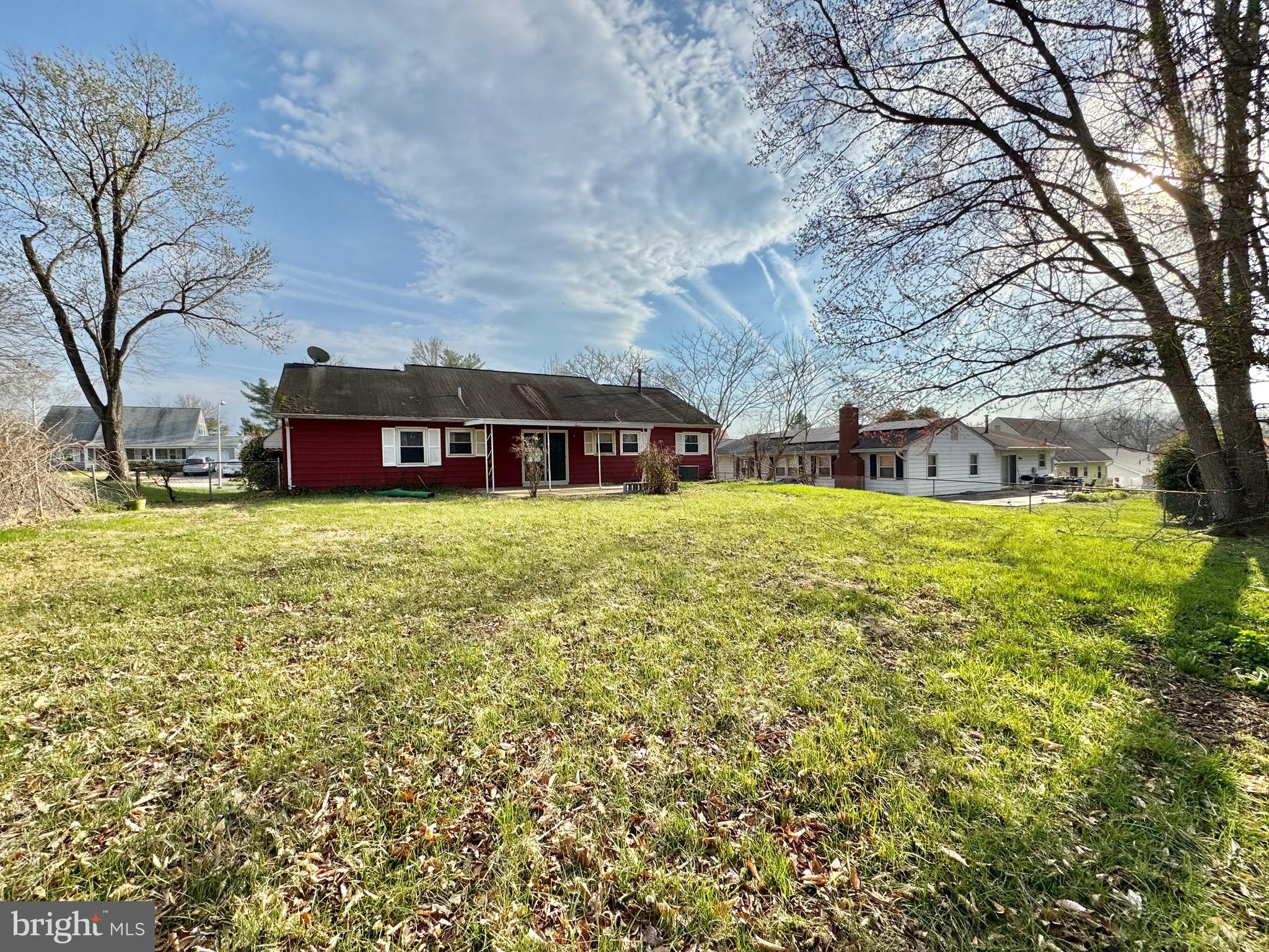 15758 Pointer Ridge Drive Bowie, MD 20716 - Photo 26 of 26 a view of a house with a big yard and large trees