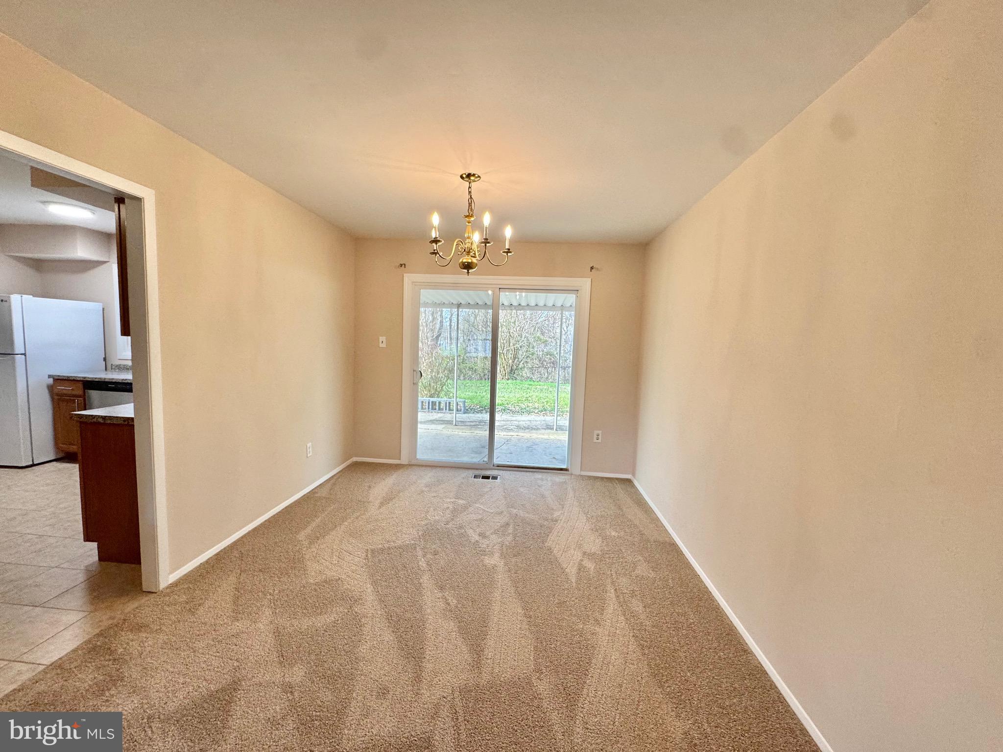 15758 Pointer Ridge Drive Bowie, MD 20716 - Photo 4 of 25 DINING RM HAS NEW CARPET & DOOR ACCESS TO KITCH