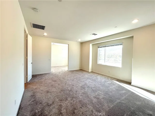 a bathroom with a white tub shower sink and mirror