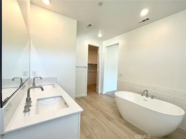 a bathroom with a bathtub and a sink