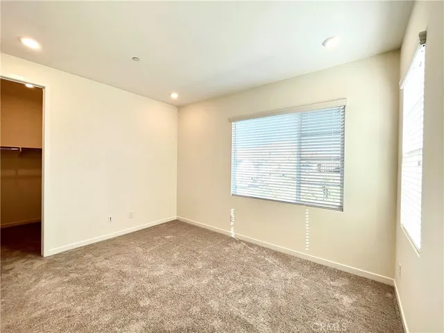 a spacious bathroom with a tub sink and mirror