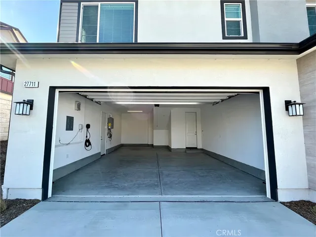 a view of a backyard with plants and a garden