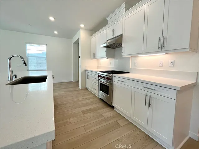 a view of a livingroom with wooden floor