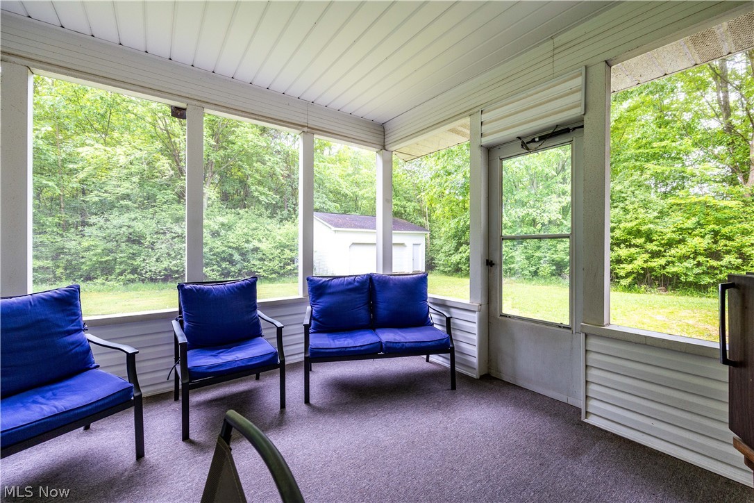6211 Russia Road Amherst, OH 44001 - Photo 17 of 50 Sunroom with a healthy amount of sunlight