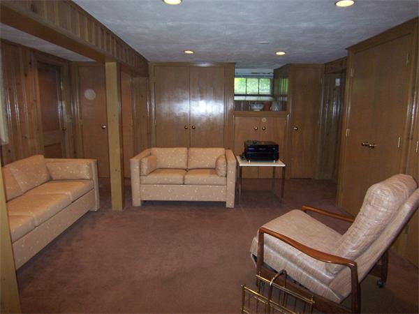 62 Judith Road Newton, MA 02459 - Photo 13 of 15 a living room with furniture and a lamp