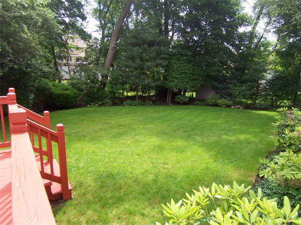 62 Judith Road Newton, MA 02459 - Photo 15 of 15 a backyard of a house with lots of green space and fountain