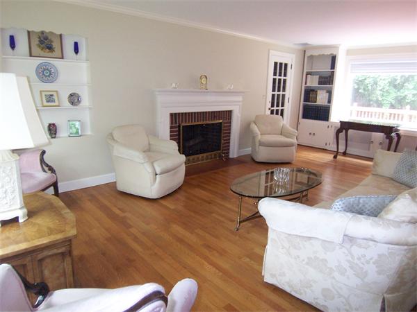 62 Judith Road Newton, MA 02459 - Photo 3 of 15 a living room with furniture and a fireplace