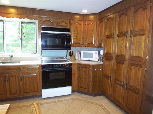 62 Judith Road Newton, MA 02459 - Photo 7 of 15 a kitchen with stainless steel appliances granite countertop a refrigerator and a sink