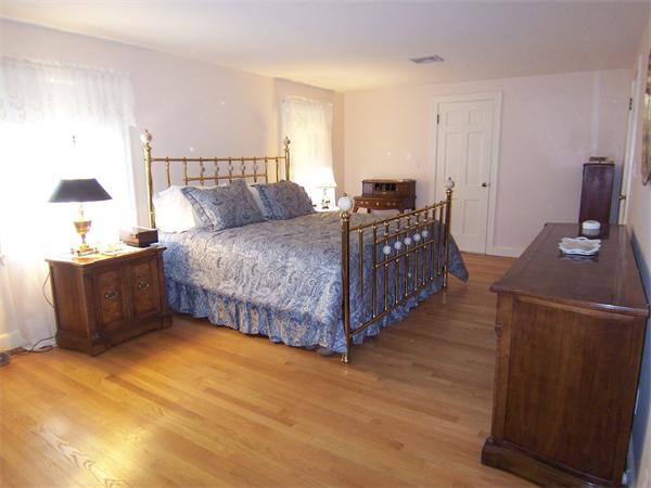 62 Judith Road Newton, MA 02459 - Photo 9 of 15 a bed room with a bed and a chair
