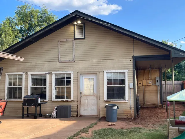 a front view of a house with sitting area