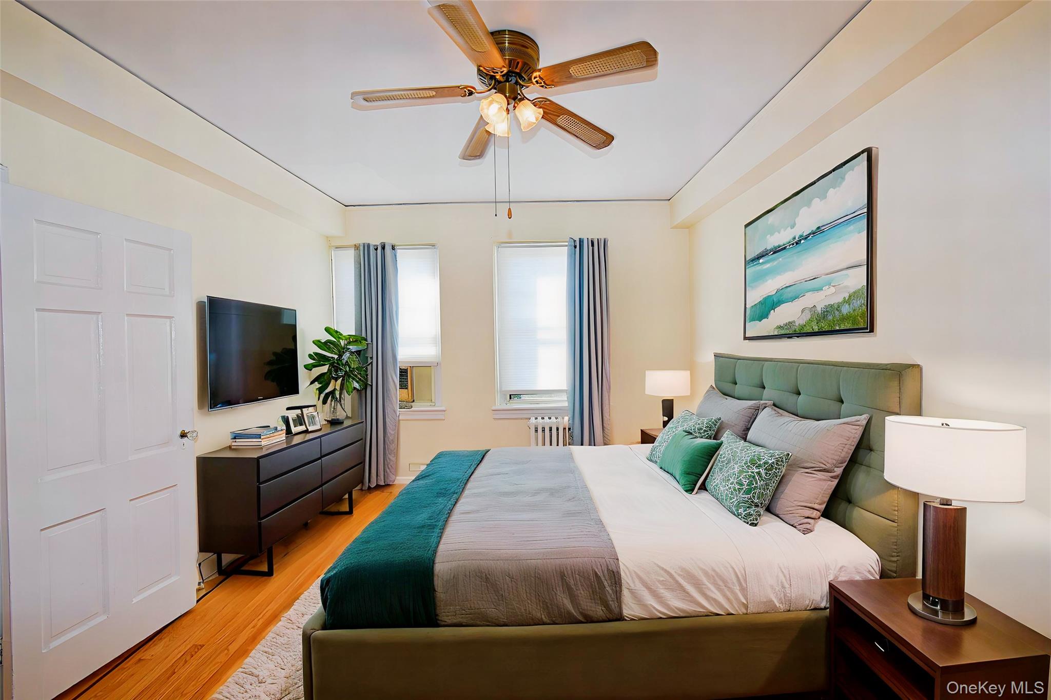 4 Park Lane, Unit 4B Mount Vernon, NY 10552 - Photo 12 of 19 a bedroom with a bed and a flat screen tv