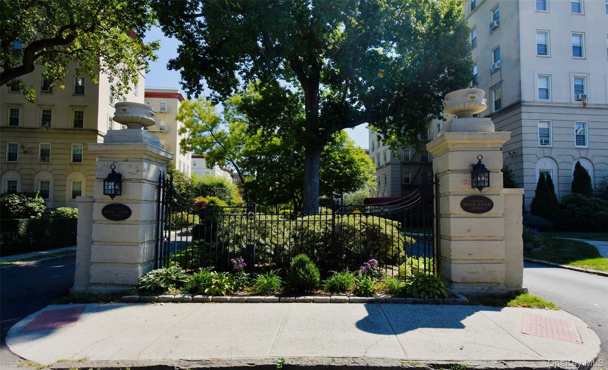 4 Park Lane, Unit 4B Mount Vernon, NY 10552 - Photo 18 of 19 a front view of a house with a yard