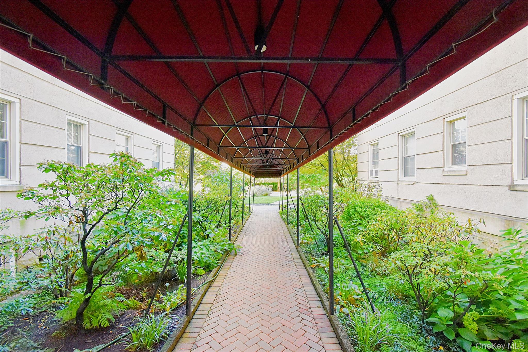 4 Park Lane, Unit 4B Mount Vernon, NY 10552 - Photo 2 of 19 a view of patio with table and chairs under an umbrella