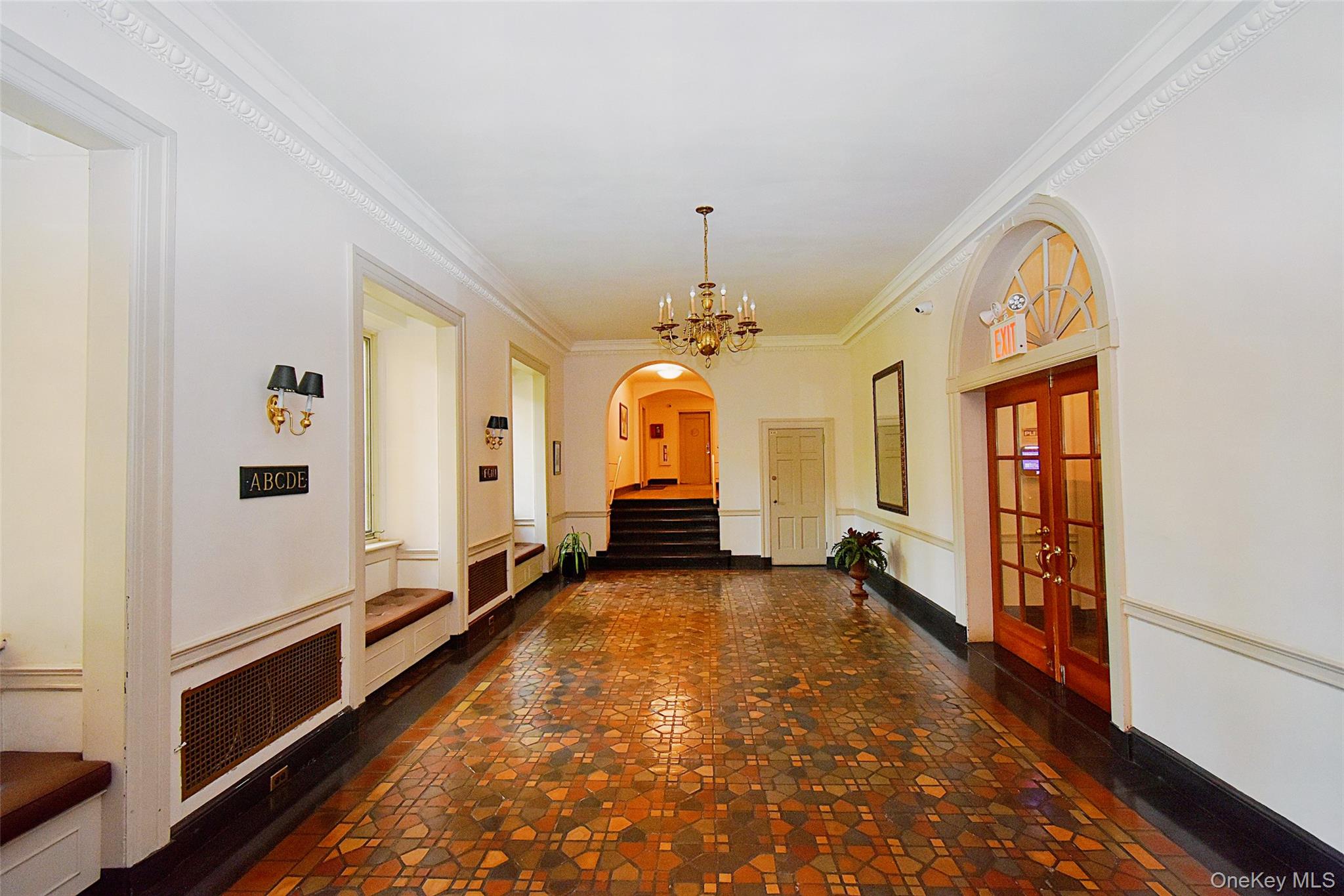 4 Park Lane, Unit 4B Mount Vernon, NY 10552 - Photo 3 of 19 a view of a hallway with wooden floor and staircase